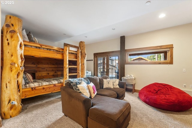 living area featuring carpet floors, recessed lighting, and healthy amount of natural light