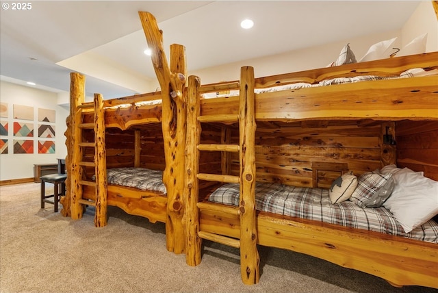 carpeted bedroom with recessed lighting