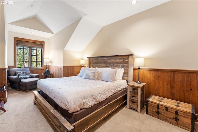 bedroom featuring wainscoting, light carpet, wooden walls, lofted ceiling, and recessed lighting