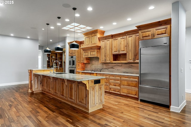 840 Sahalee Ct, Salem, OR 97306 - kitchen with appliances with stainless steel finishes, baseboards, a sink, wood finished floors, and recessed lighting