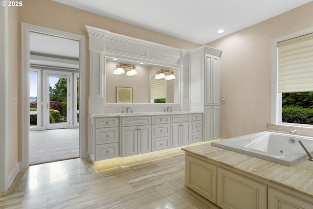 840 Sahalee Ct, Salem, OR 97306 - full bathroom with double vanity, a whirlpool tub, and recessed lighting
