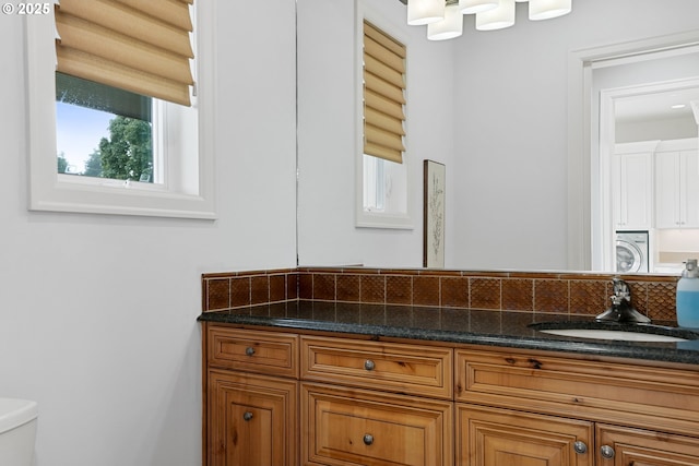 840 Sahalee Ct, Salem, OR 97306 - bathroom featuring toilet, vanity, and washer / dryer