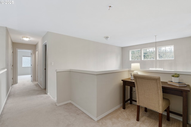 office featuring light colored carpet and baseboards