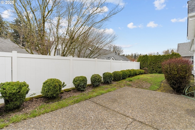 view of patio featuring fence