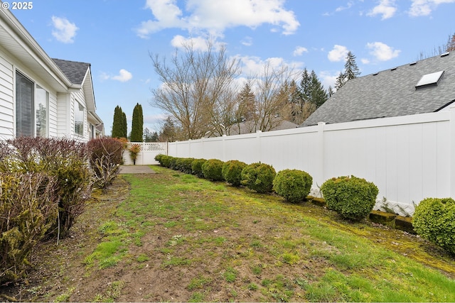 view of yard with a fenced backyard