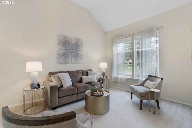 living room with carpet floors, baseboards, and vaulted ceiling