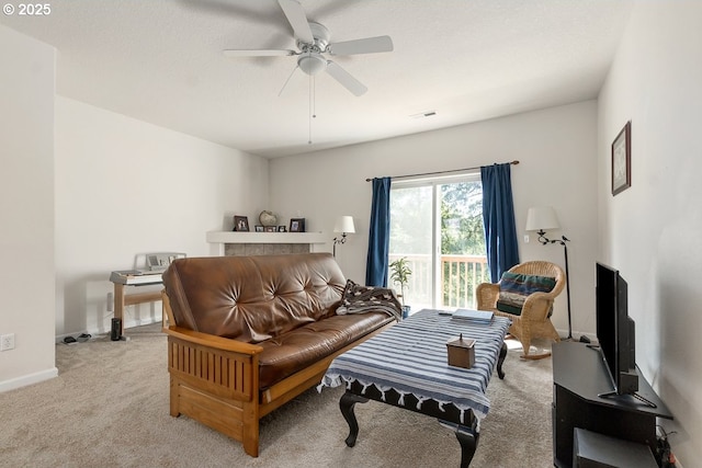living area featuring carpet, visible vents, a ceiling fan, and baseboards