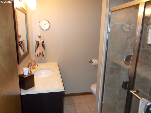 43497 Shetland Ct, Pendleton, OR 97801 - full bathroom featuring vanity, a shower stall, tile patterned flooring, and toilet