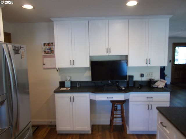 43497 Shetland Ct, Pendleton, OR 97801 - kitchen with stainless steel fridge with ice dispenser, dark countertops, recessed lighting, and white cabinets