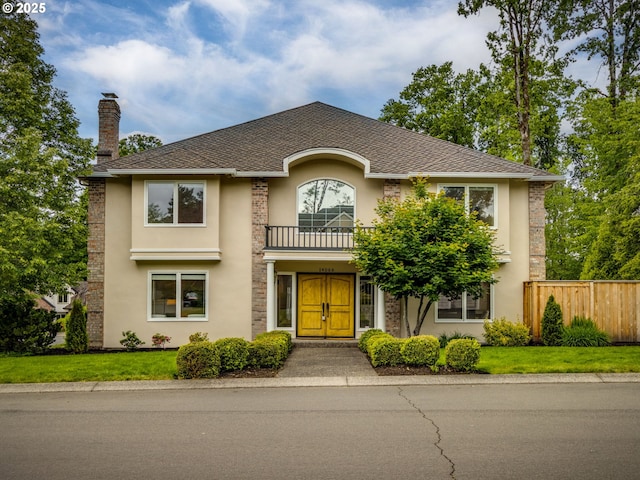 14066 Edenberry Dr, Lake Oswego, OR 97035 - view of front of house with a balcony, stucco siding, and a chimney