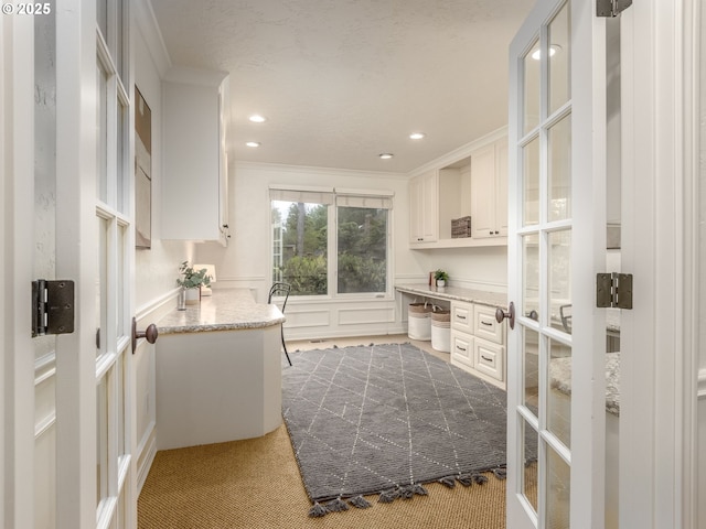 14066 Edenberry Dr, Lake Oswego, OR 97035 - kitchen with crown molding, carpet flooring, white cabinets, recessed lighting, and glass insert cabinets