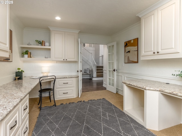 14066 Edenberry Dr, Lake Oswego, OR 97035 - kitchen with open shelves, carpet flooring, crown molding, white cabinetry, and light stone countertops