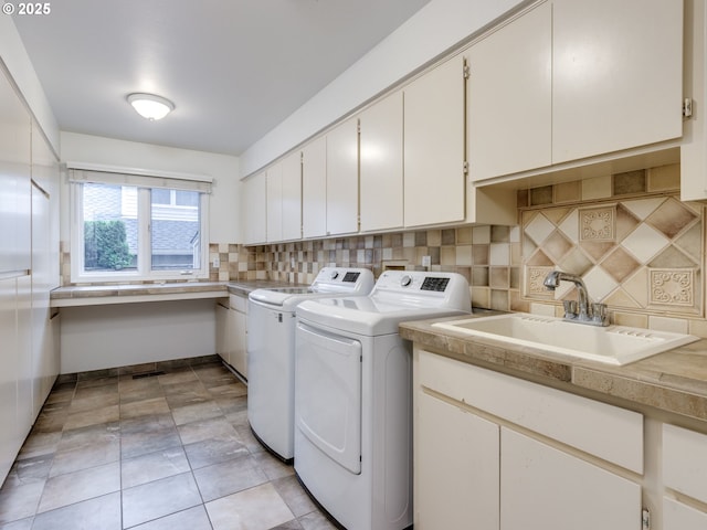 14066 Edenberry Dr, Lake Oswego, OR 97035 - laundry area featuring independent washer and dryer and cabinet space