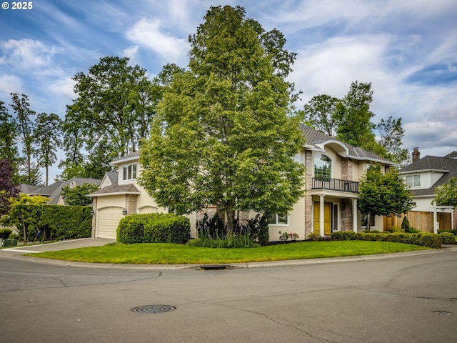 14066 Edenberry Dr, Lake Oswego, OR 97035 - obstructed view of property featuring asphalt driveway, a garage, a front yard, and a balcony