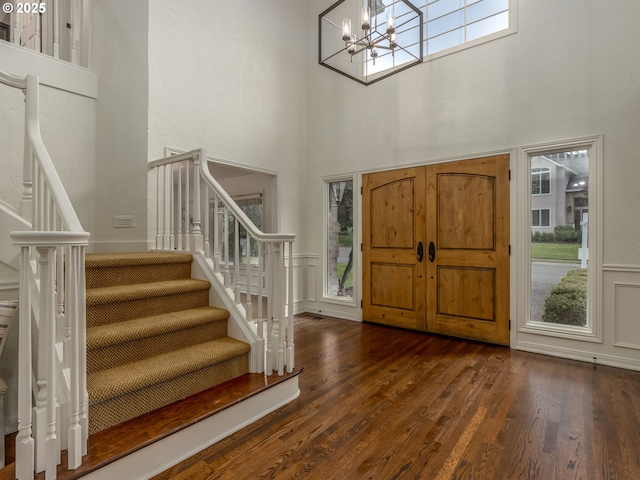 14066 Edenberry Dr, Lake Oswego, OR 97035 - entryway with stairs, a towering ceiling, plenty of natural light, a chandelier, and dark wood-style floors