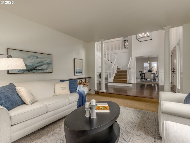 14066 Edenberry Dr, Lake Oswego, OR 97035 - living room with stairway, a chandelier, and decorative columns