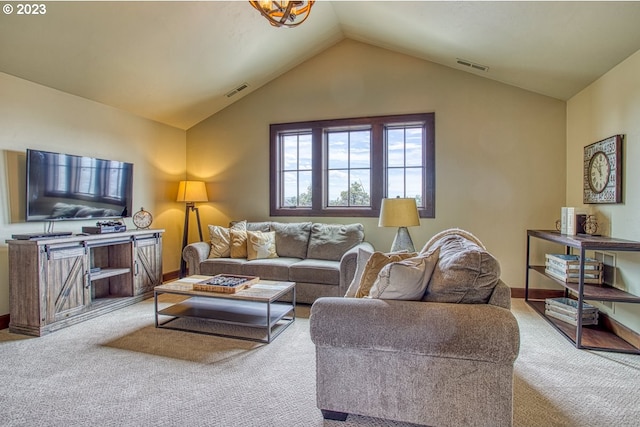 15905 SW Wooden Trestle Ct, Powell Butte, OR 97753 - carpeted living room featuring vaulted ceiling, baseboards, and visible vents