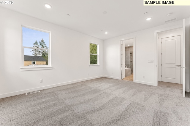 2149 NE Singer Ln, Estacada, OR 97023 - unfurnished bedroom featuring recessed lighting, carpet flooring, ensuite bath, visible vents, and baseboards