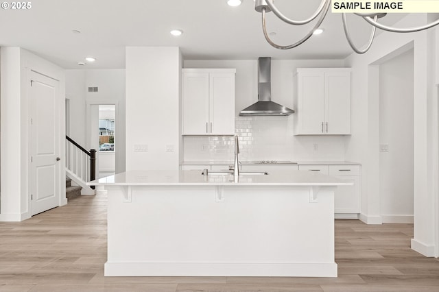 2149 NE Singer Ln, Estacada, OR 97023 - kitchen with white cabinets, a sink, light countertops, wall chimney exhaust hood, and backsplash