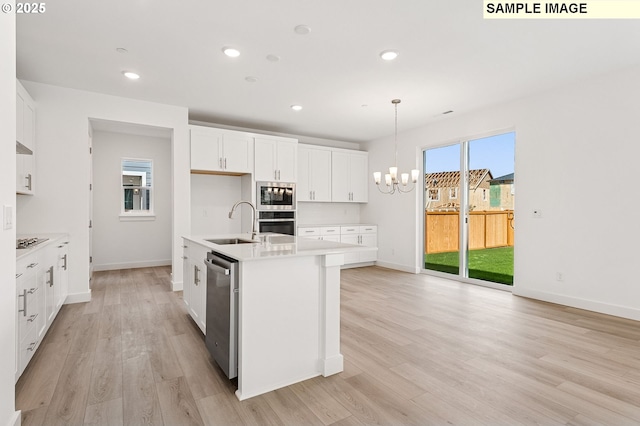 2149 NE Singer Ln, Estacada, OR 97023 - kitchen featuring white cabinetry, a sink, a chandelier, stainless steel appliances, and light countertops