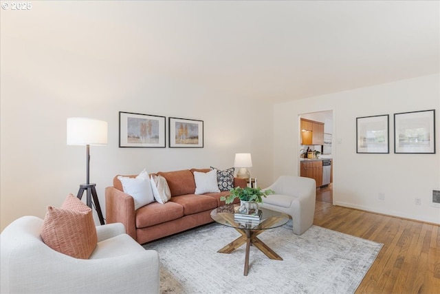 5310 NE 10th Ave, Portland, OR 97211 - living area with baseboards, light wood-style flooring, and visible vents