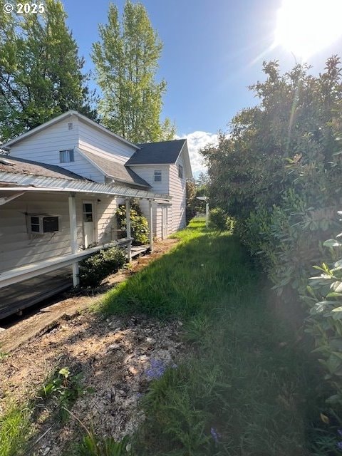view of side of property with metal roof