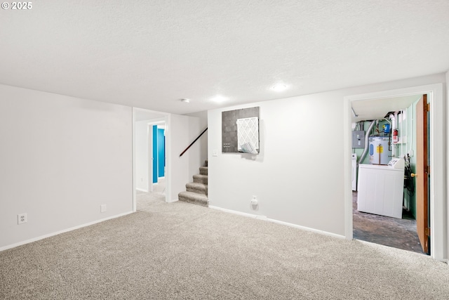 finished below grade area with stairway, independent washer and dryer, carpet floors, and a textured ceiling