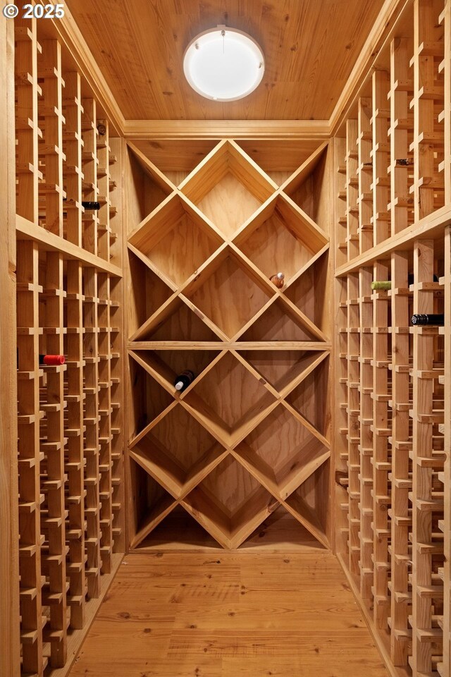 wine cellar with wood ceiling and wood finished floors