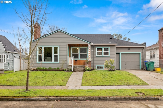 view of front of property featuring a shingled roof, a front yard, a chimney, driveway, and an attached garage