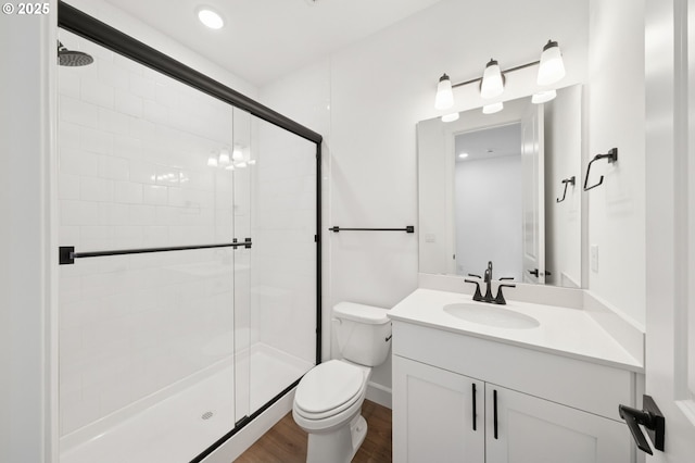 11016 NE 131st Ct, Vancouver, WA 98682 - bathroom with a shower stall, toilet, vanity, and wood finished floors