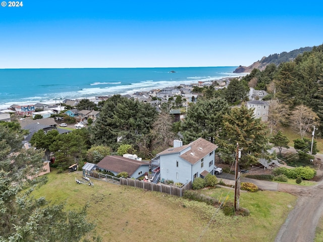 birds eye view of property featuring a beach view and a water view