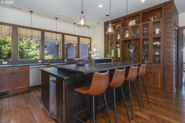 7850 Brooten Mountain Loop, Pacific City, OR 97135 - indoor dry bar with dishwasher, dark wood-style flooring, plenty of natural light, recessed lighting, and hanging light fixtures