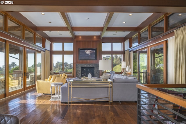 7850 Brooten Mountain Loop, Pacific City, OR 97135 - living area with plenty of natural light, a large fireplace, beamed ceiling, dark wood-style floors, and coffered ceiling
