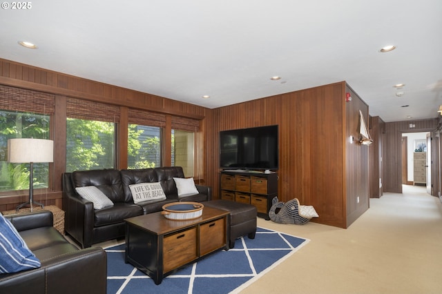 7850 Brooten Mountain Loop, Pacific City, OR 97135 - living area featuring plenty of natural light, carpet flooring, recessed lighting, and wooden walls
