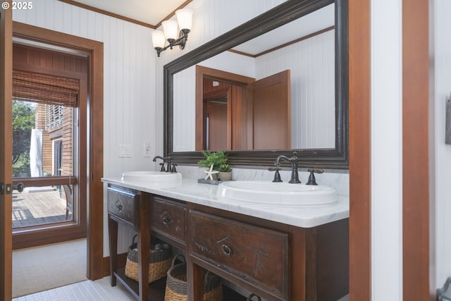 7850 Brooten Mountain Loop, Pacific City, OR 97135 - bathroom featuring ornamental molding, double vanity, and wood walls