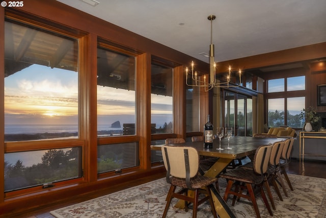 7850 Brooten Mountain Loop, Pacific City, OR 97135 - dining space with wood finished floors and a chandelier