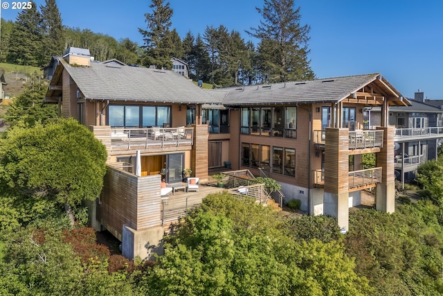 7850 Brooten Mountain Loop, Pacific City, OR 97135 - rear view of house featuring a balcony