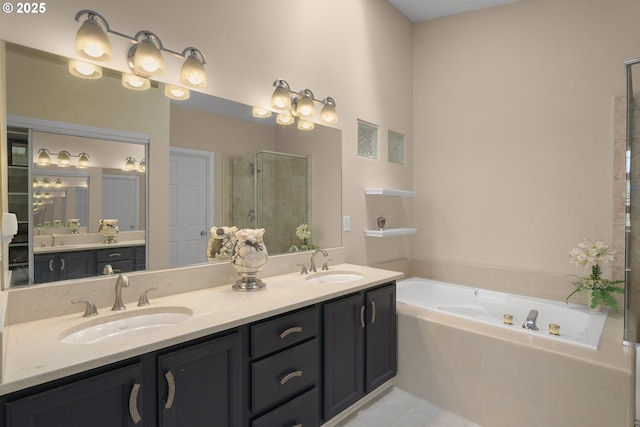 bathroom featuring a sink, double vanity, a stall shower, and a bath