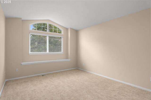 living area featuring visible vents, carpet, and baseboards