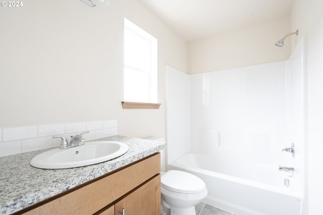 full bathroom with vanity, shower / tub combination, backsplash, tile patterned floors, and toilet