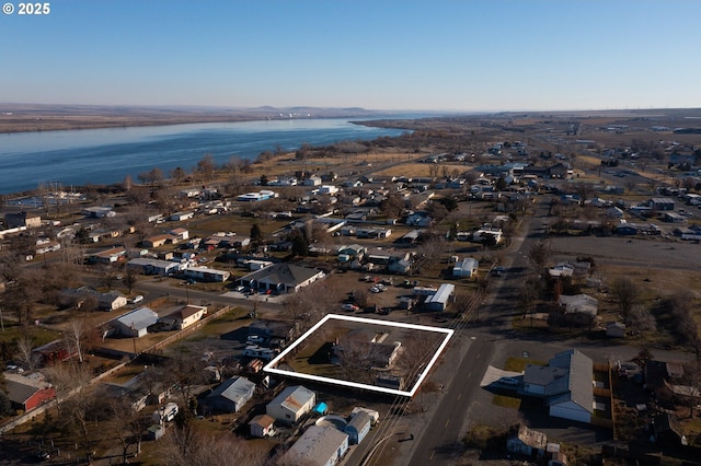 drone / aerial view featuring a water view