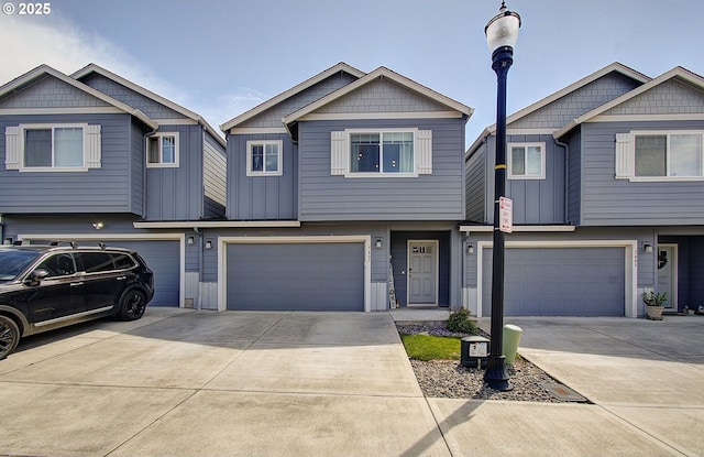 7407 NE 136th Ave, Vancouver, WA 98682 - townhome / multi-family property with a garage, driveway, and board and batten siding