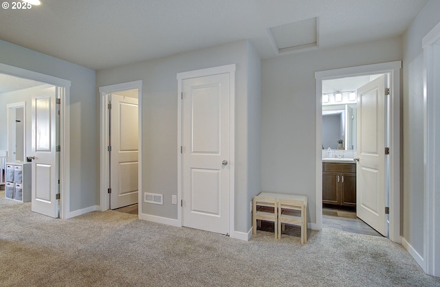 7407 NE 136th Ave, Vancouver, WA 98682 - unfurnished bedroom featuring light colored carpet, attic access, and ensuite bathroom