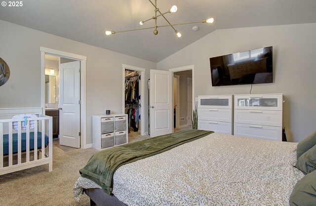 7407 NE 136th Ave, Vancouver, WA 98682 - bedroom featuring vaulted ceiling, light colored carpet, a chandelier, a walk in closet, and a closet