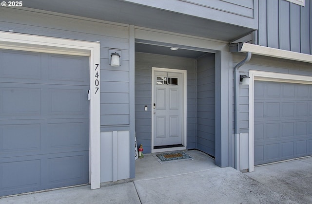 7407 NE 136th Ave, Vancouver, WA 98682 - doorway to property featuring a garage and board and batten siding