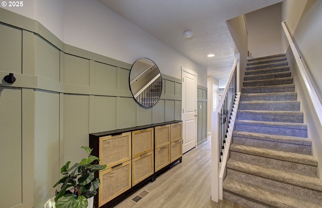 7407 NE 136th Ave, Vancouver, WA 98682 - stairs featuring wood finished floors, a textured ceiling, and recessed lighting