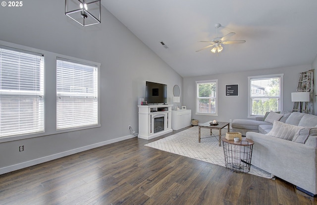 1812 NW 14th St, Battle Ground, WA 98604 - living room with dark wood finished floors, a ceiling fan, high vaulted ceiling, and a fireplace