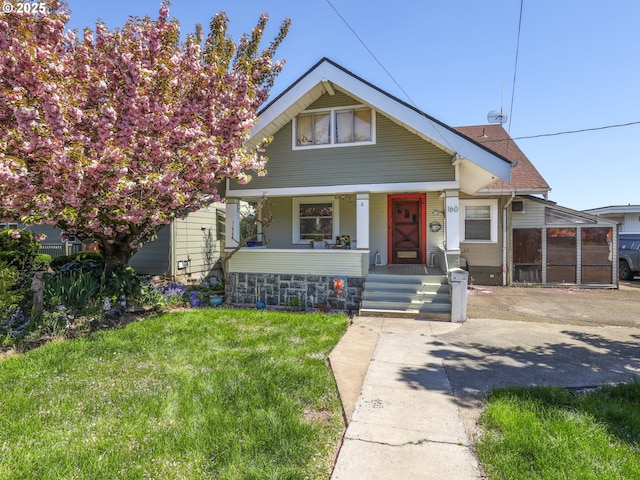 160 S 1st St, Saint Helens, OR 97051 - bungalow-style home featuring a porch, a front lawn, and a sunroom