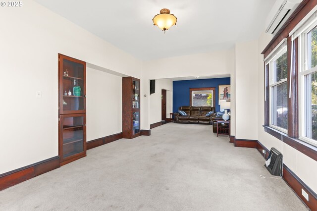 160 S 1st St, Saint Helens, OR 97051 - corridor featuring carpet, a wall mounted air conditioner, and baseboards