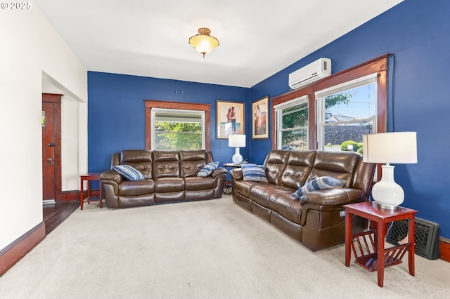 160 S 1st St, Saint Helens, OR 97051 - living room featuring a wall mounted AC, carpet floors, and baseboards